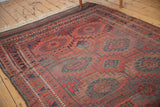 Antique Belouch carpet with geometric gul motifs and unique abrash color variations.