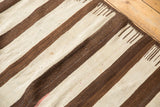 Hand woven Turkish Kilim's ivory and chocolate brown striped pattern with comb effect.
