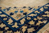 Antique Chinese Peking carpet: deep blue border with beige flying bat motifs and ivory patterned field.