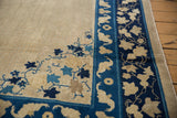 Unusual cobalt blue border with ivory flying bats on an antique Peking carpet.