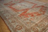 Distressed Veece carpet with textured low pile, faded brick red, seafoam geometric patterns.