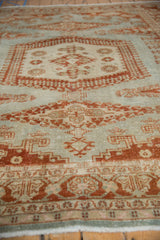 Low-angle view showcasing the mostly even wear and low pile on this vintage Veece carpet.
