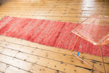 Abstract vintage Moroccan runner, faded cherry red long pile and wefting.