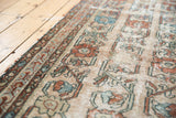 Antique Lilihan rug runner displaying distressed floral vinery, worn pile, and exposed foundation.