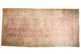 Antique Khotan carpet with faded cinnabar red, ivory, stemmed pomegranate motif, dynamic abrashes.