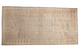 Antique distressed Khotan rug, platinum, silver tones, faded terra cotta pomegranate motifs.