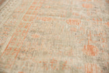 Soft, even pile of the antique Khotan rug, with platinum and terra cotta pomegranate motifs.