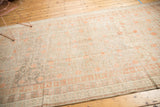 Evenly distressed antique Khotan runner with subtle pomegranate motifs and soft terra cotta blush.