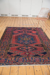 Vintage Veece rug, black cherry red, navy blue, oversized medallion with elongated diamond finials.