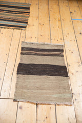 Vintage Turkish Kilim rug mat, hand woven with nuanced gray, silver, and charcoal horizontal stripes.