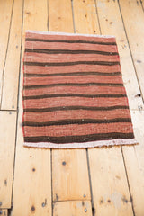Vintage hand-woven Turkish Kilim rug detail, wine red and chocolate banded pattern.