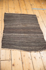Handwoven vintage Turkish Kilim rug with tone-on-tone charcoal and oxidized silver stripes.