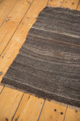 Tone-on-tone charcoal, oxidized silver, platinum shades on hand woven vintage Turkish Kilim rug.