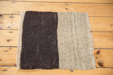 Beige handwoven flatweave texture with natural fringed edge on a vintage Kilim mat.