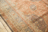 Soft, distressed pile of a Turkish Kaisery rug, with dusty rose field and slate grey motifs.
