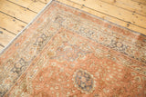 Distressed vintage Turkish Kaisery carpet corner featuring plush dusty rose, slate grey floral borders.
