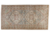 Vintage distressed Persian Mahal carpet featuring double medallions and faded blue, terracotta, celadon vinery. 5'11