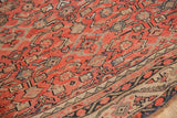 Vintage Karabagh carpet's low pile, brick red Herati motif, and Mir Serbend border.