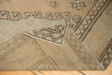 Vintage Distressed Oushak rug showing even pile wear to knot heads and hand-knotted foundation.