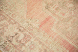 Textural detail of vintage distressed Oushak pile, showing blush pink, ivory, and soft wear.