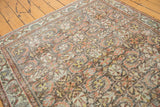 Decorative distressed Mahal carpet with worn terracotta, ivory, and dark teal floral motifs.