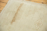 Distressed Oushak carpet showing low pile texture, abrash, and a stepped geometric border.