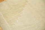 Stepped zig-zag border detail with textured abrash on a distressed vintage Oushak rug.