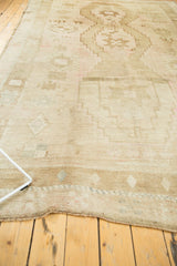 Low pile texture and intact original selvage on distressed vintage Oushak rug.