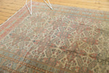 Distressed vintage Kayseri carpet, allover geometric floral design, with mostly even wear.