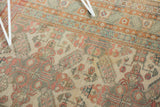 Textured geometric floral burst motif with mostly even wear on this distressed Kayseri rug.