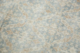Vintage distressed Oushak carpet's pile texture with floral lattice in slate blue and ivory.