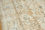 Ivory and pale gold distressed vintage Sparta carpet, with blue and tan floral pattern.