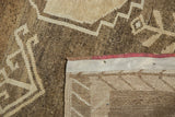 Oushak low pile, visible knot heads, and hand-knotted reverse with secured edge.