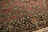 Distressed vintage Arak carpet, sarouk style floral pattern with faded red, charcoal, and beige.