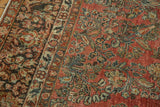 Distressed cinnabar red Arak rug with sarouk style floral motifs and visible wear.