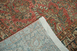 Vintage Distressed Arak carpet, close-up of worn cinnabar floral pile and hand-knotted foundation.