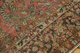 Decorative distressed pattern with dusty cinnabar red and charcoal floral bouquets.