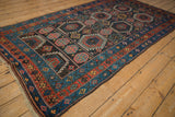Geometric floral guls in alternating panels of vintage Kurdish rug in charcoal, mallard green, and blush.