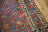 Antique Northwest Persian rug with raspberry red plant lattice and ornate border.