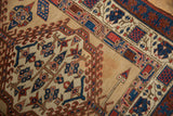 A small area of discoloration shown on the antique Serab runner's sand-colored field.