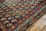 Staggered boteh motif and detailed multi-color border on this antique Persian Kurdish runner.