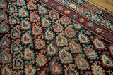 Antique Kurdish rug: staggered blush, sky blue, ivory boteh field and geometric red border.