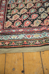 Antique Persian Kurdish runner showing detailed borders and repeating colorful boteh design.