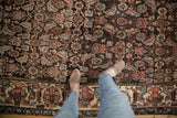 Vintage Kurdish Bijar rug, herati motif field meeting its oversized floral palmette border.