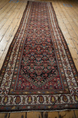 Traditional Persian Malayer runner, intricate germinating flower pattern, madder red and blue.