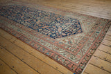 Vintage Malayer runner side with blush, beige, and navy border details.