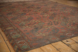 Ersari carpet's secured side, displaying gul motifs in dark brick red and navy blue.