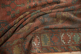 Antique hand-knotted Ersari rug detail with brick red, navy, green gul motifs, textured pile.