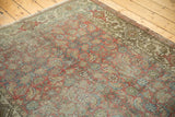 Distressed vintage Hamadan runner corner displaying worn Herati pattern and turtle samovar border.