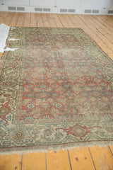 Fragmented Hamadan runner detail: Herati motif, turtle border, exposed foundation.